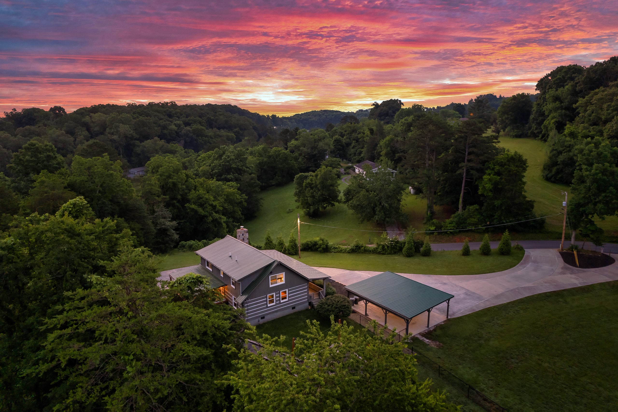 Hillside Haven cabin nestled in Tennessee mountains with spectacular sunset sky