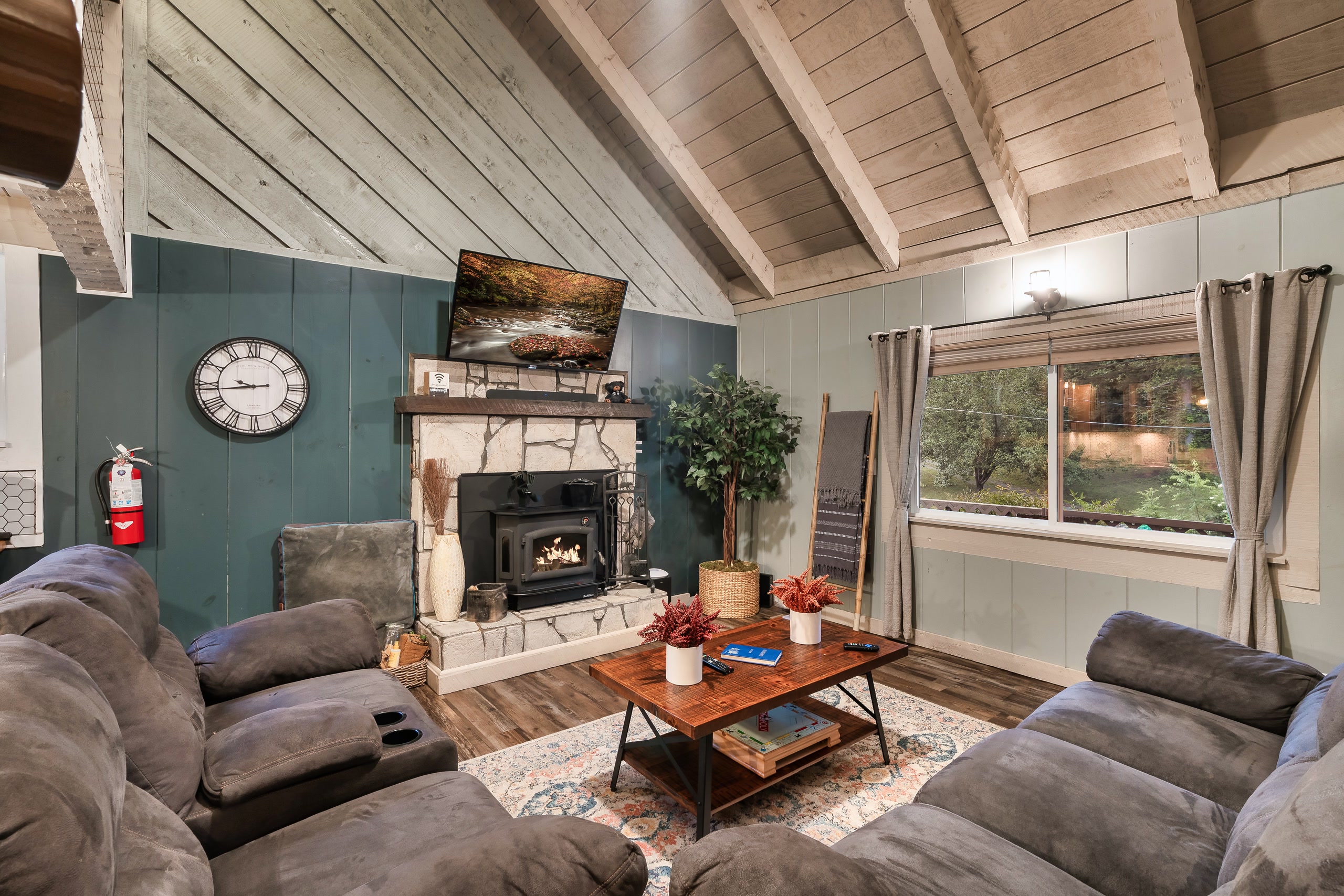 Hillside Haven living room with sectional sofas and teal accent wall in Tennessee