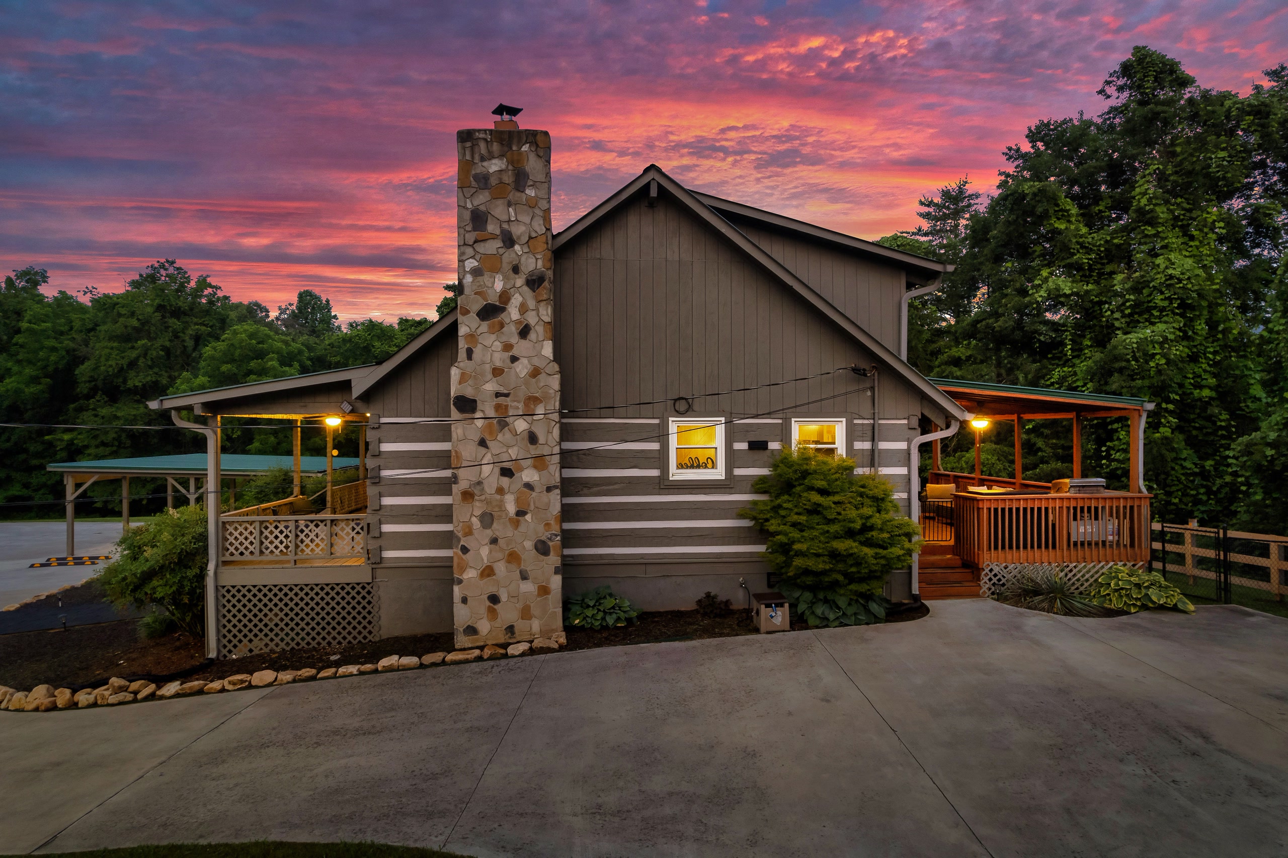 Hillside Haven cabin with covered porch and elevated deck at sunset in Tennessee
