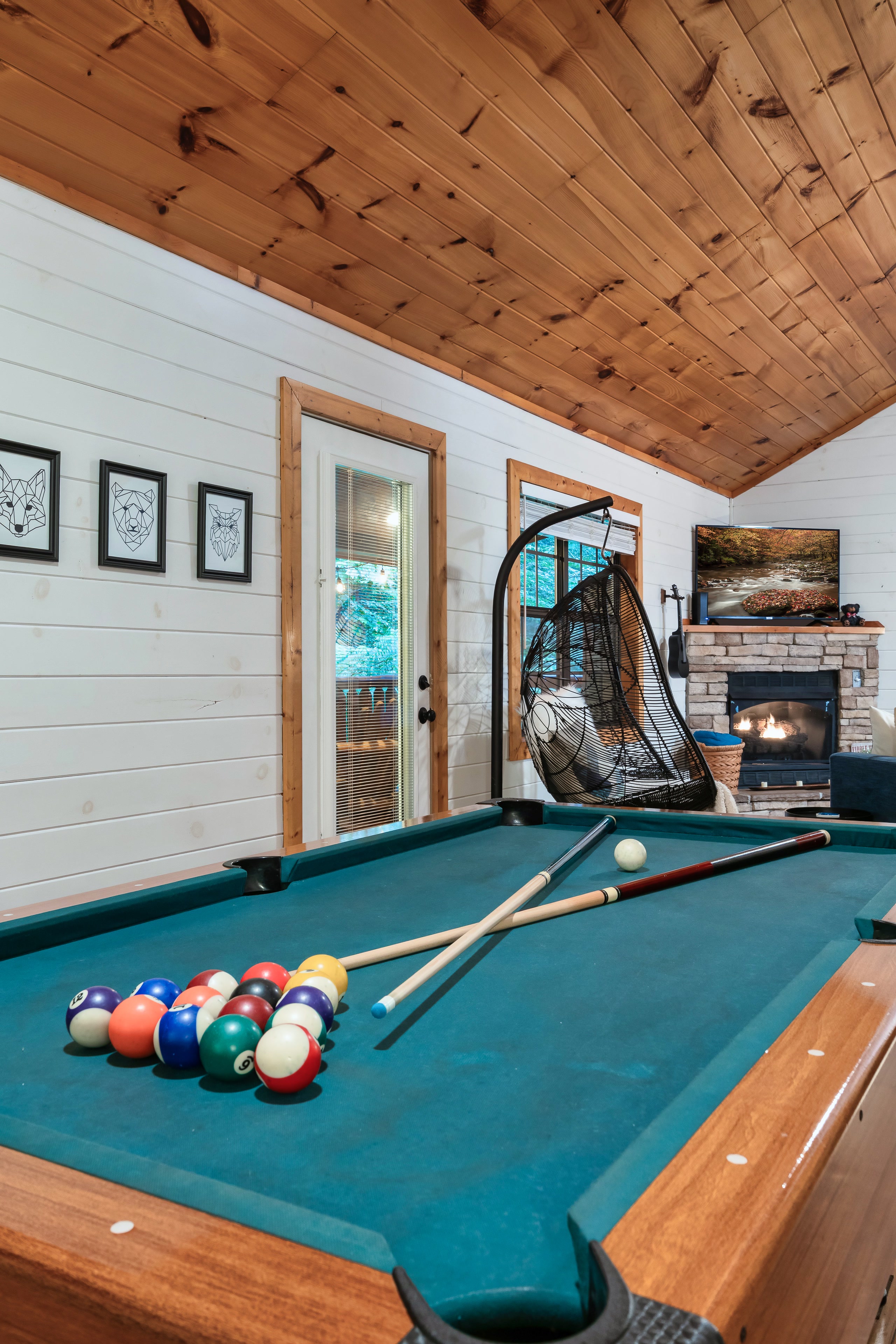 Pool table and hanging bubble chair at Smoky Creek Hideaway Tennessee