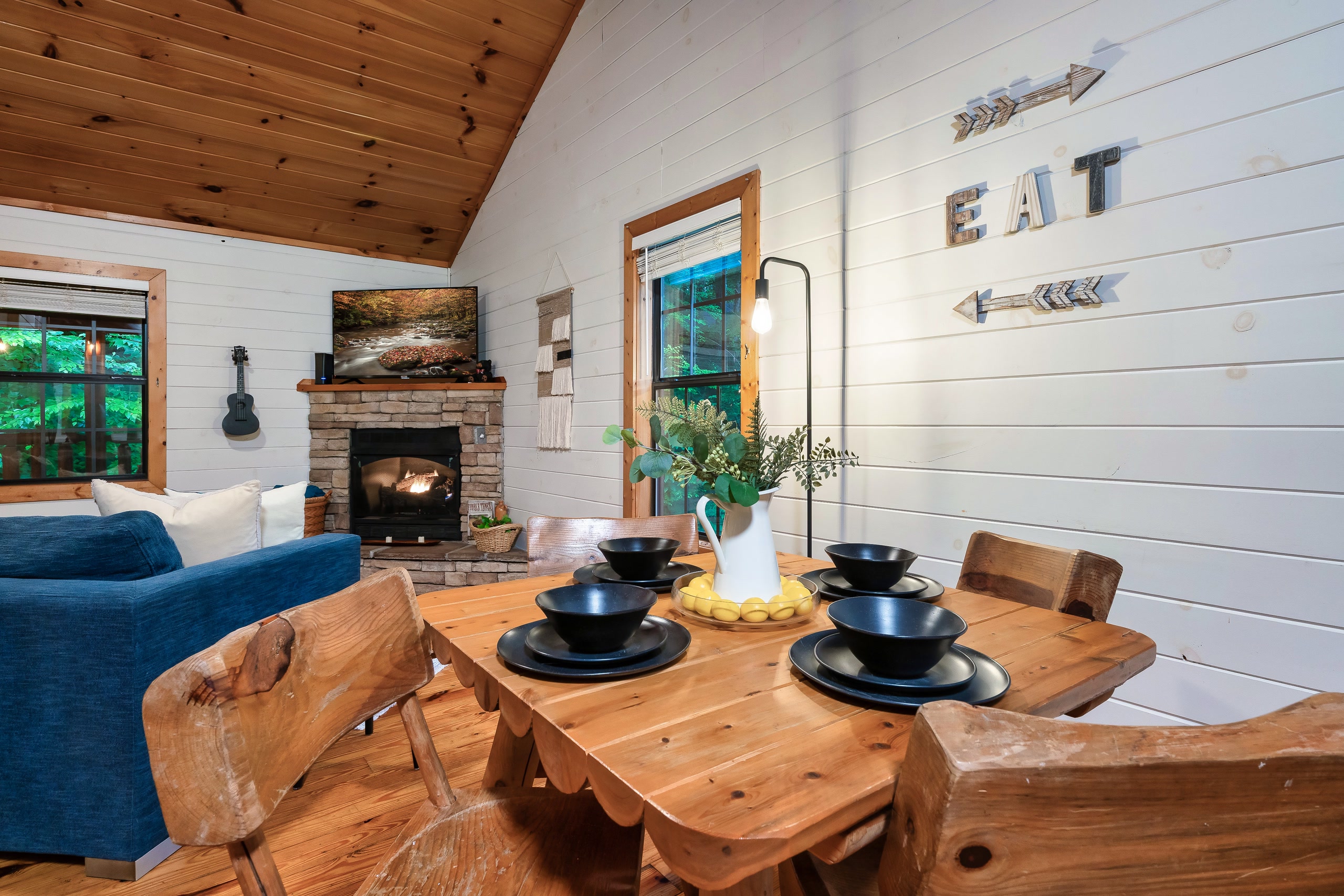 Live-edge dining table with fireplace view at Tennessee mountain cabin