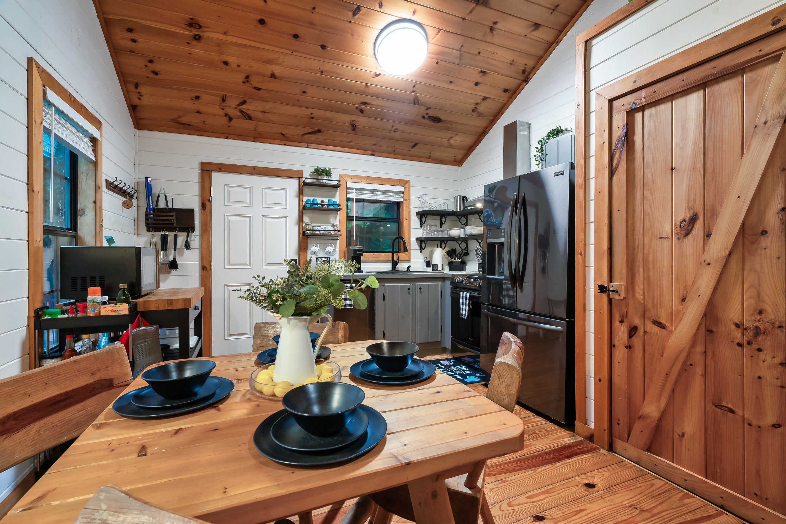 Dining area and modern farmhouse kitchen at Smoky Creek Hideaway Tennessee