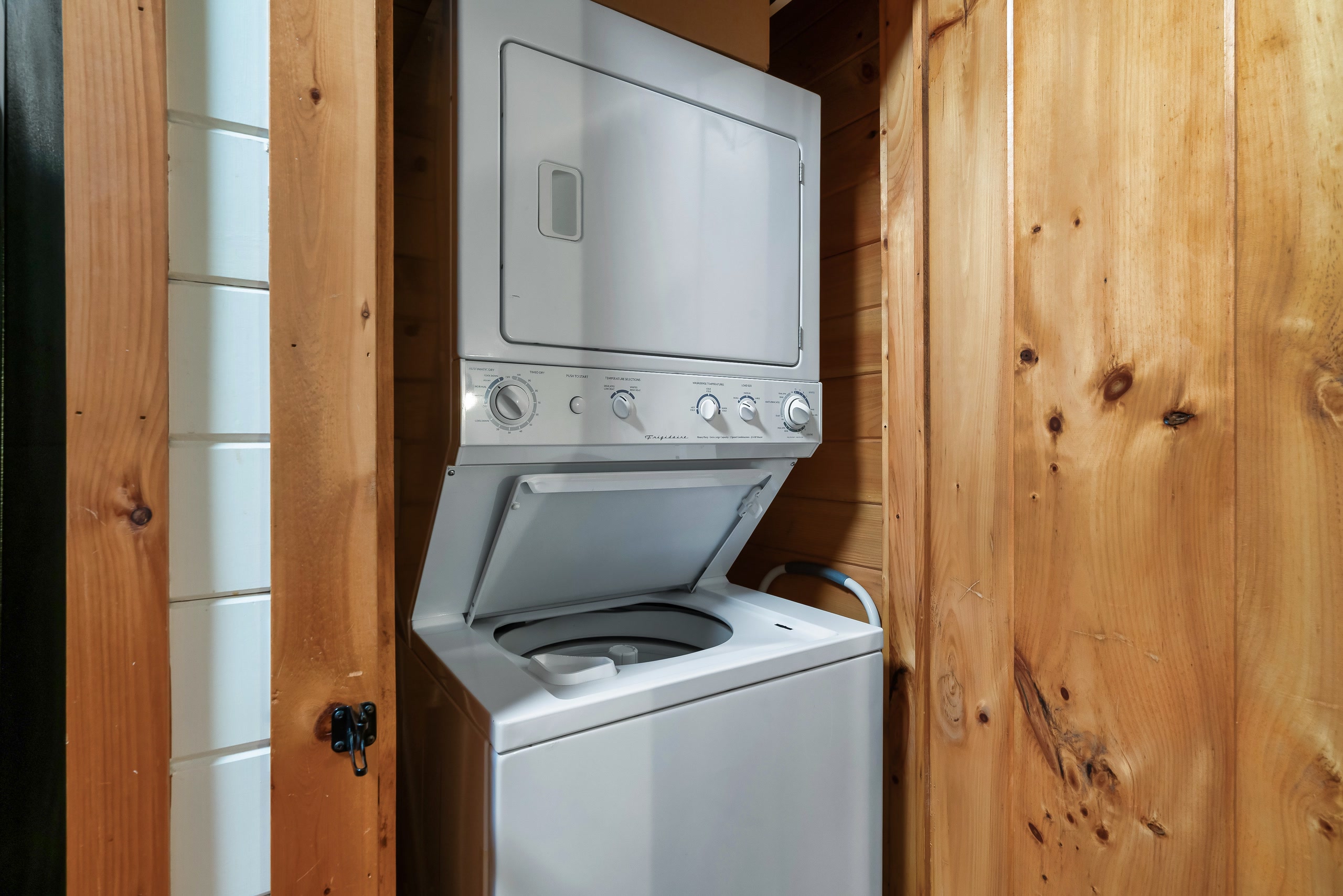 Stacked washer and dryer in Smoky Creek Hideaway Tennessee cabin