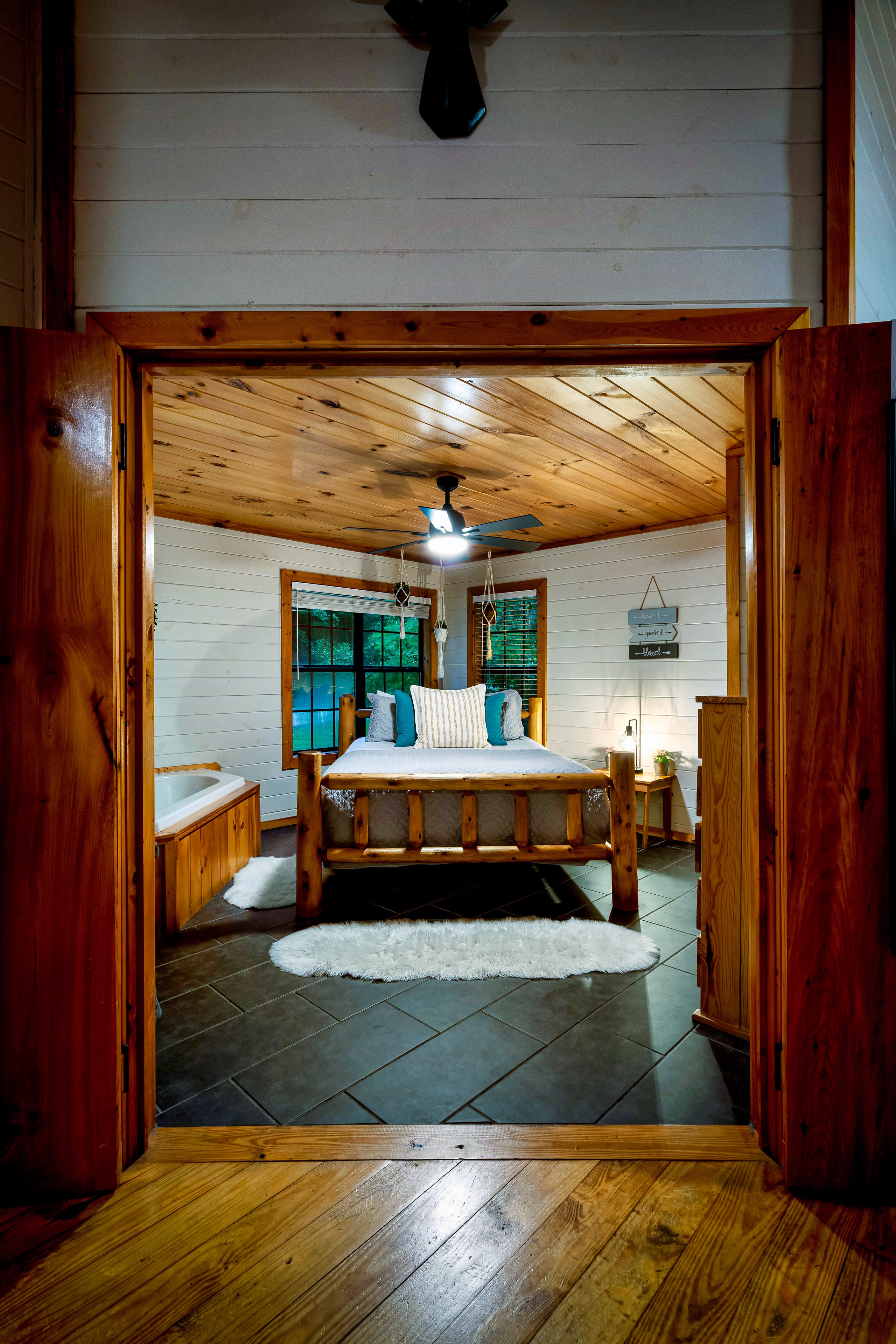 View through doorway to master bedroom with jetted tub at Tennessee cabin