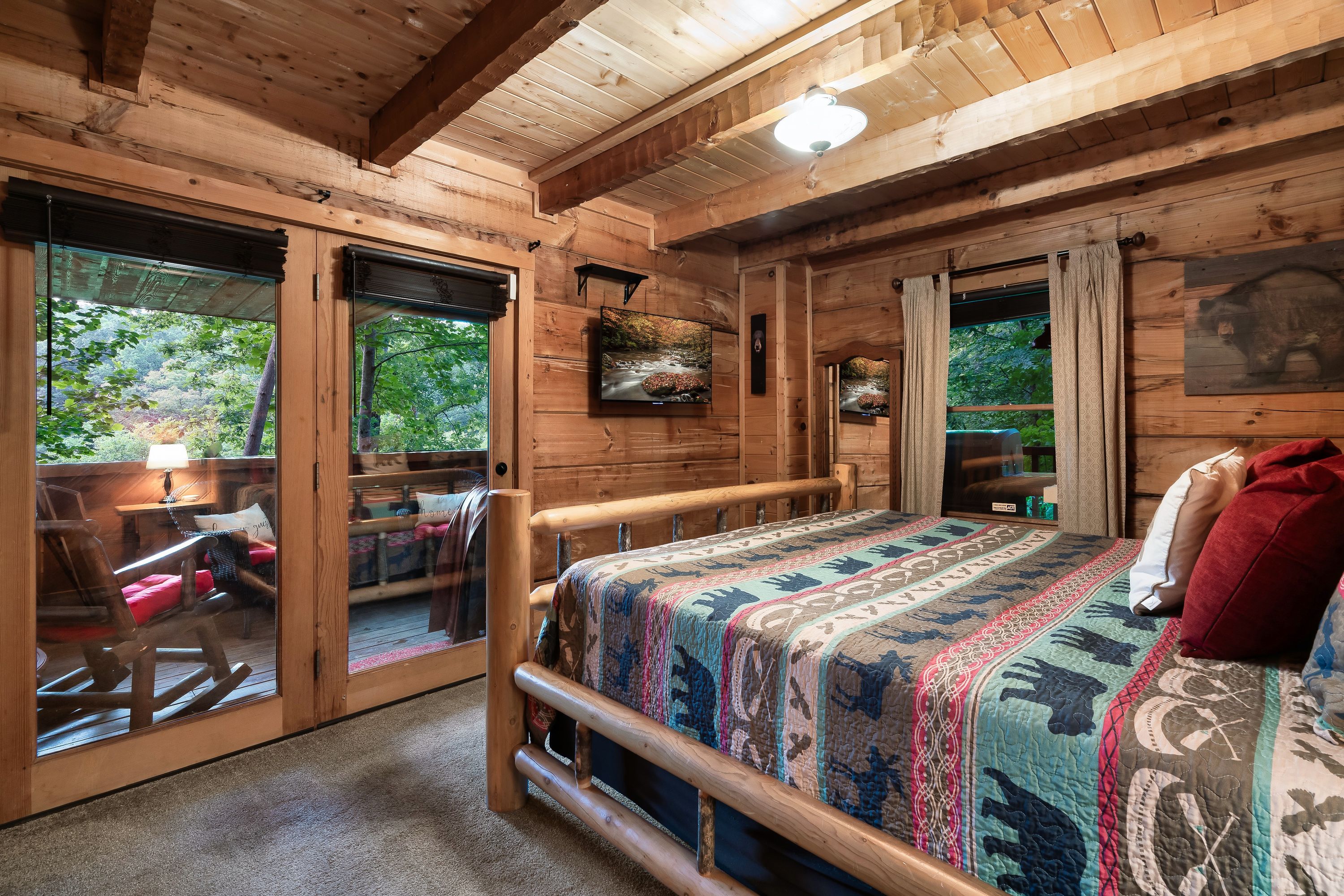 Rustic Rooster bedroom with log bed and wildlife quilt in Tennessee