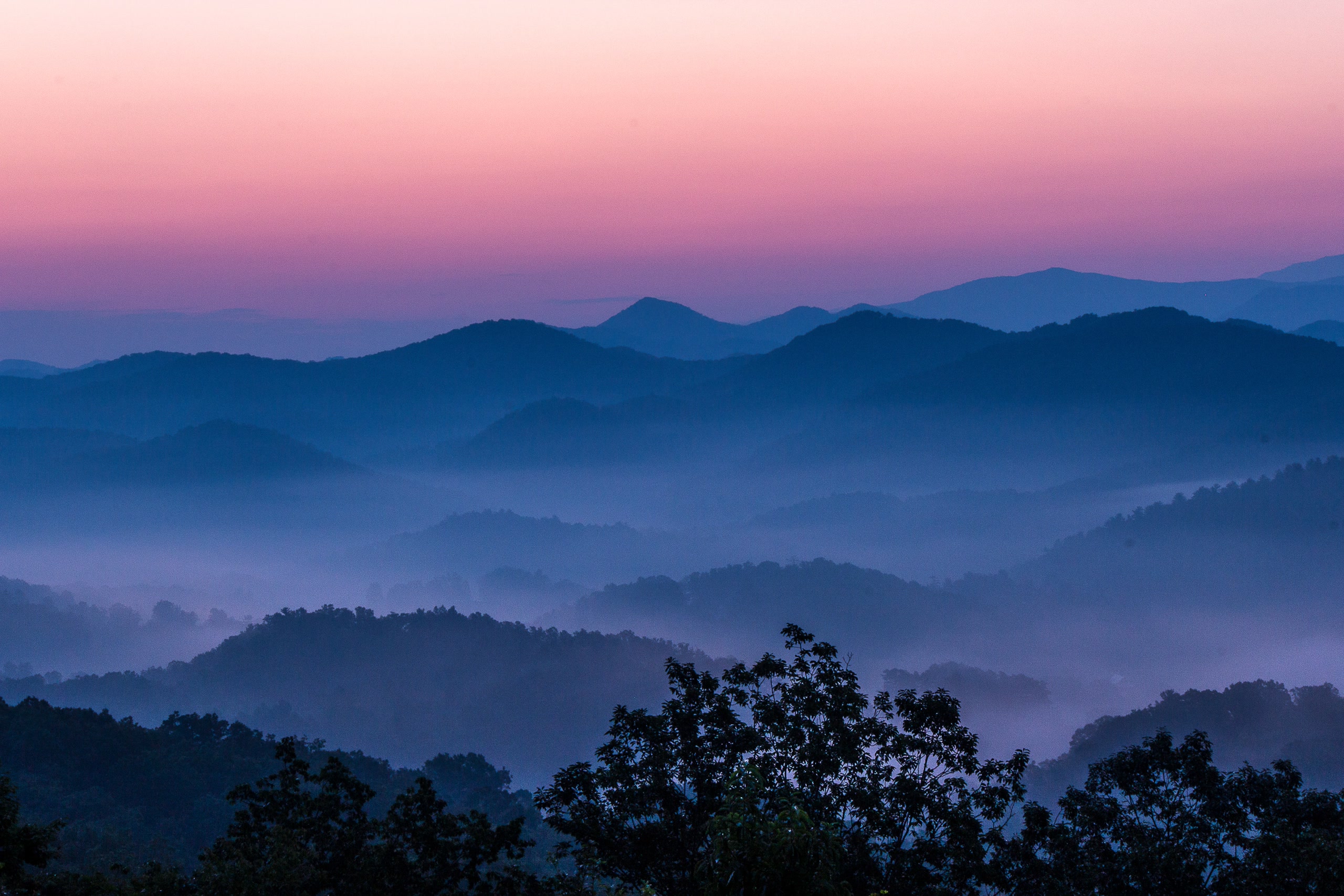 Smoky Mountains sunrise with layered ridges near Rustic Rooster Tennessee