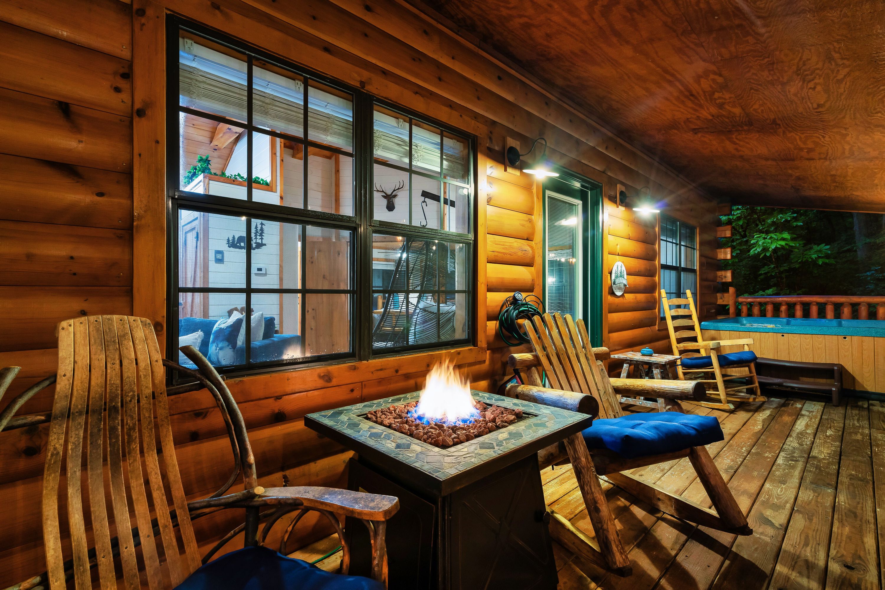 Cabin porch with fire pit and hot tub